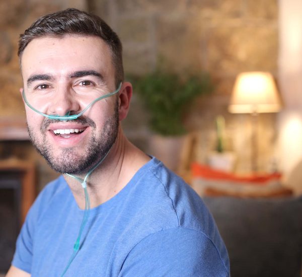 Man using nasal breathing aid